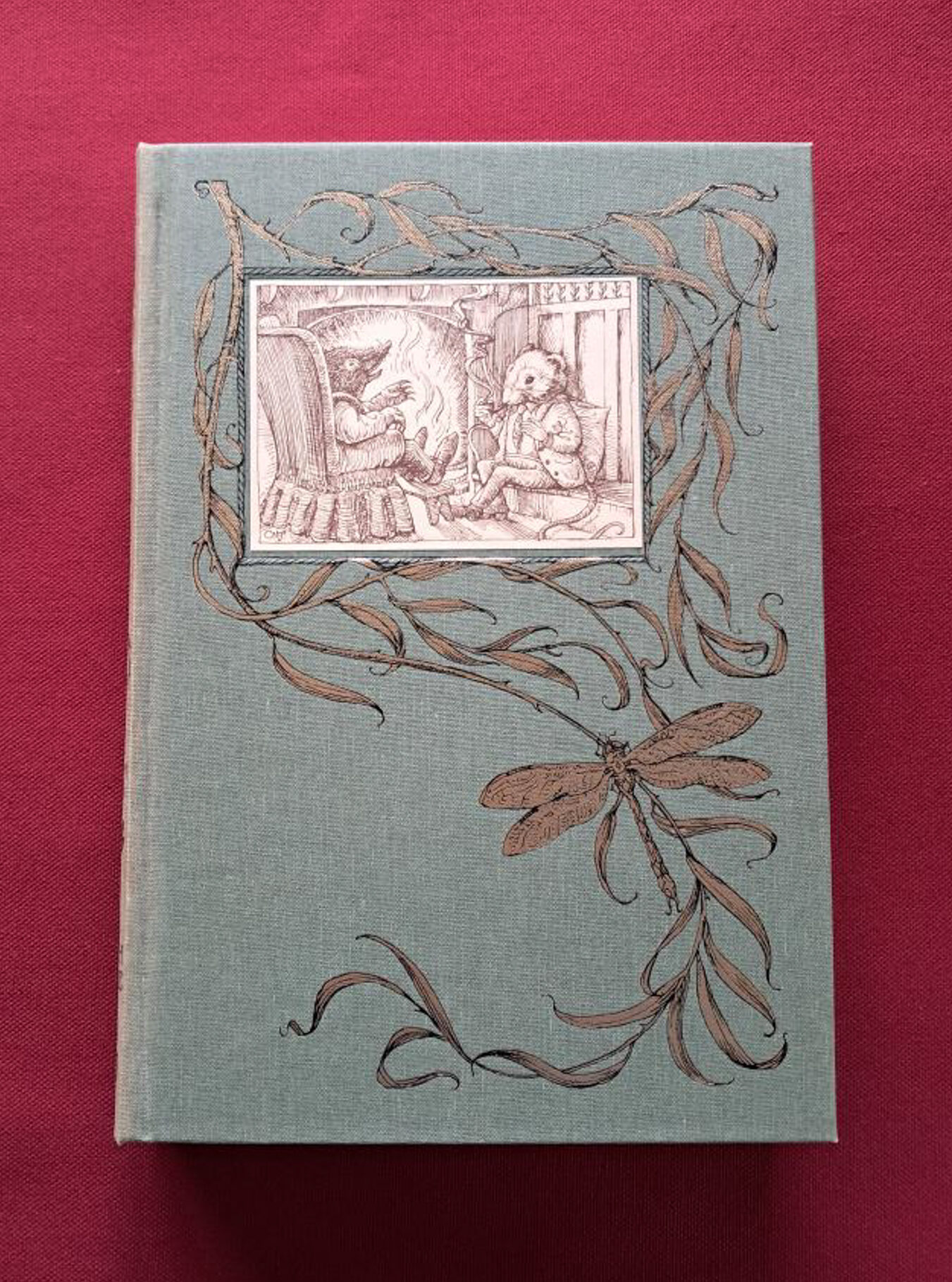 Wind in the willows. A light green cover with beautiful illustration, set on a red background