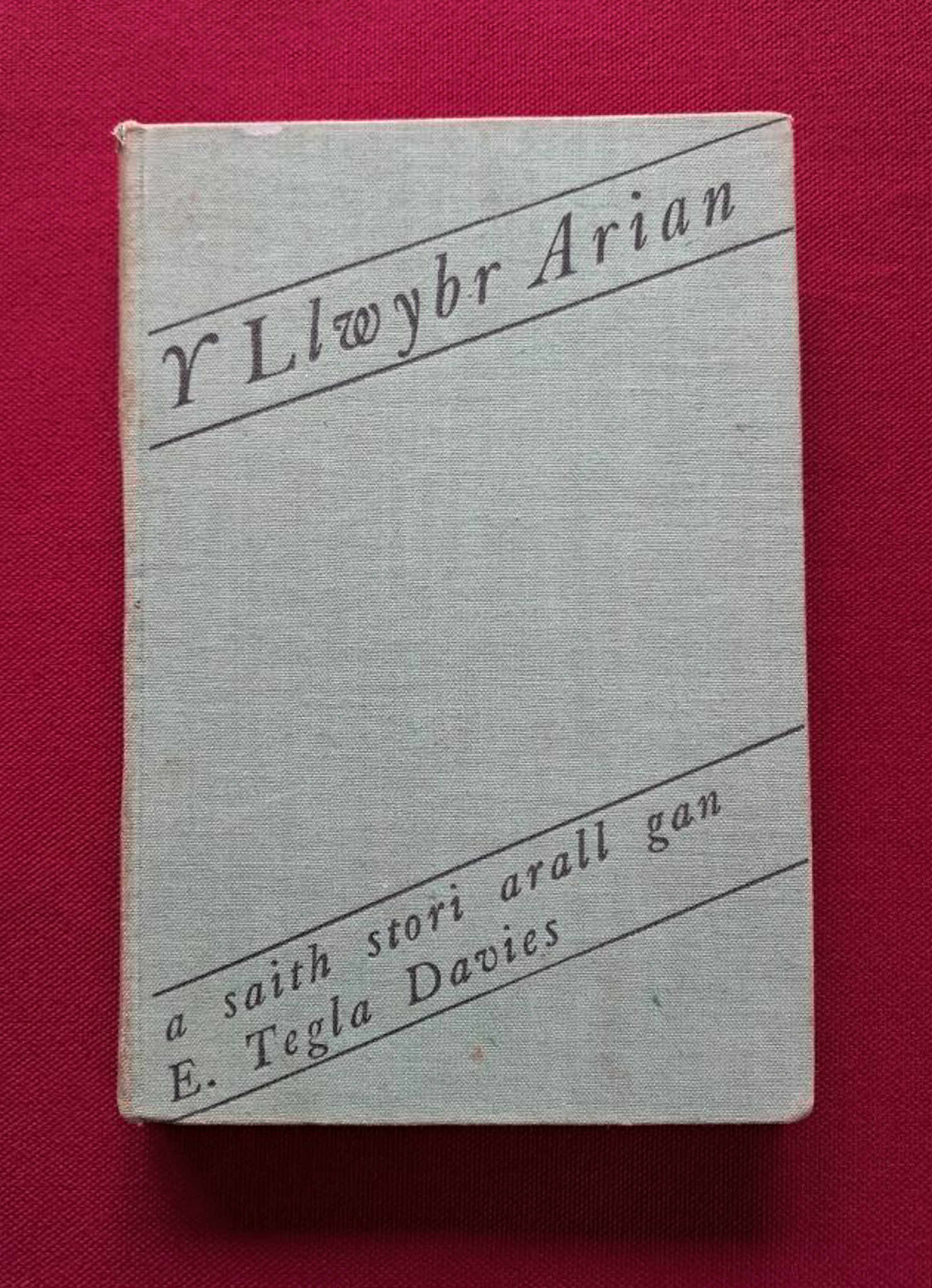 Y Llwybr Arian. Light green cover on dark red background