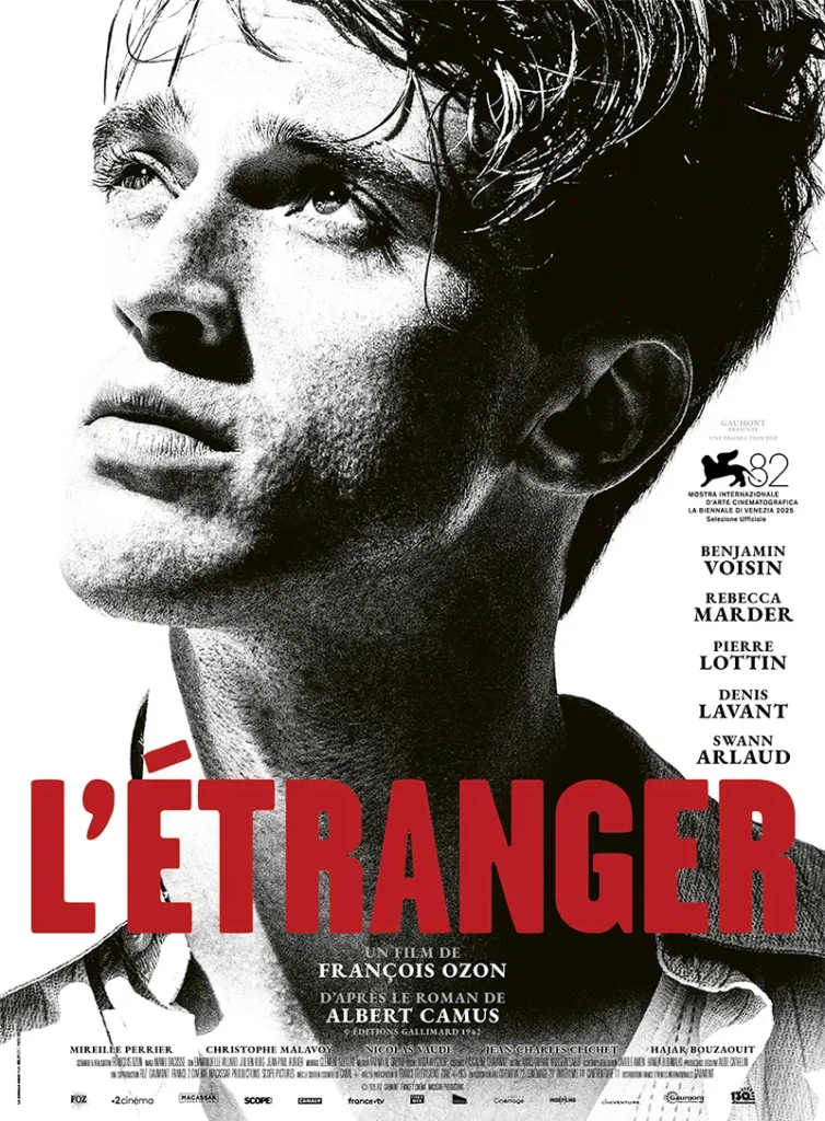 The poster for The Stranger (2025), depicting a black and white close-up of a young man's face looking off to the side, with bold red text stating "L'Etranger".

The image helps the reader to identify the film, and gives a sense of its aesthetic.